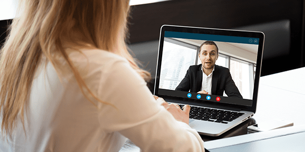woman having a meeting over video chat with man