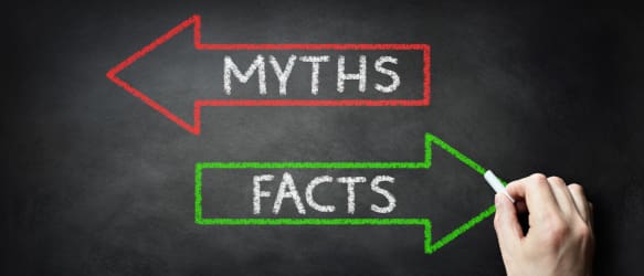 two arrows on a chalkboard read myths and facts