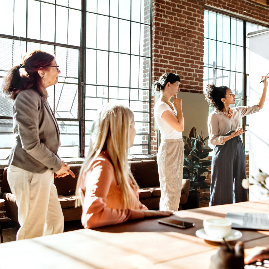 Addison Group's workforce planning guide page, featuring 4 people working.