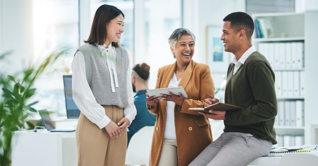 Group of contract talent talking at an organization that used Addison Group's tips to engage and retain them