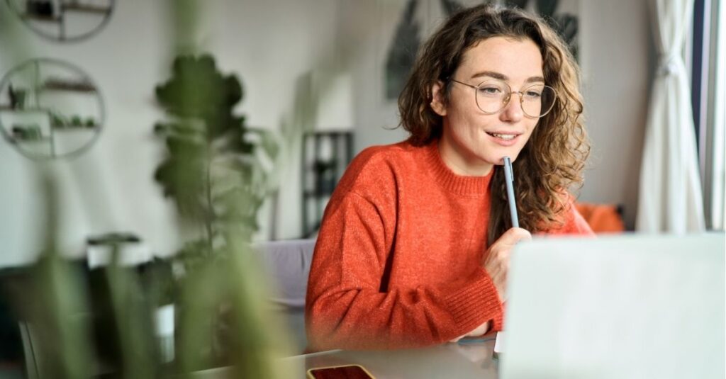 Someone tailoring their resume to the job description using Addison Group's tips