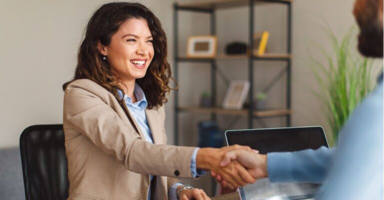 Someone using Addison Group's advice on how to answer 'tell me about yourself' in an interview