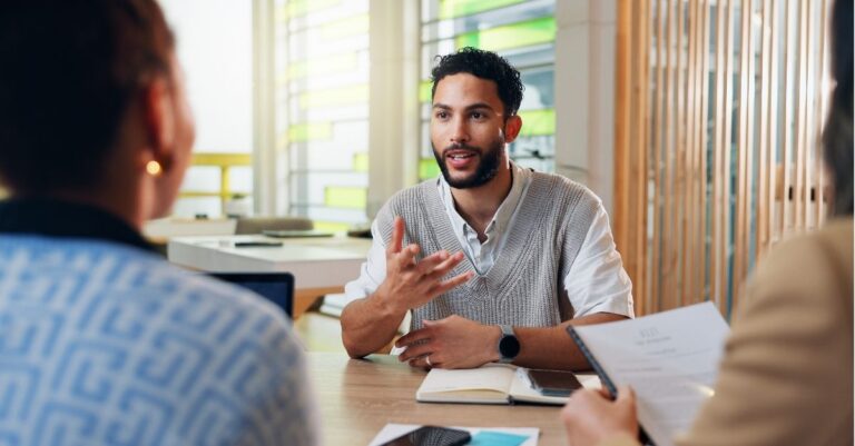 Hiring managers listening to a candidate's answer to the 'tell me about yourself' interview question and identifying strong answers based on Addison Group's advice