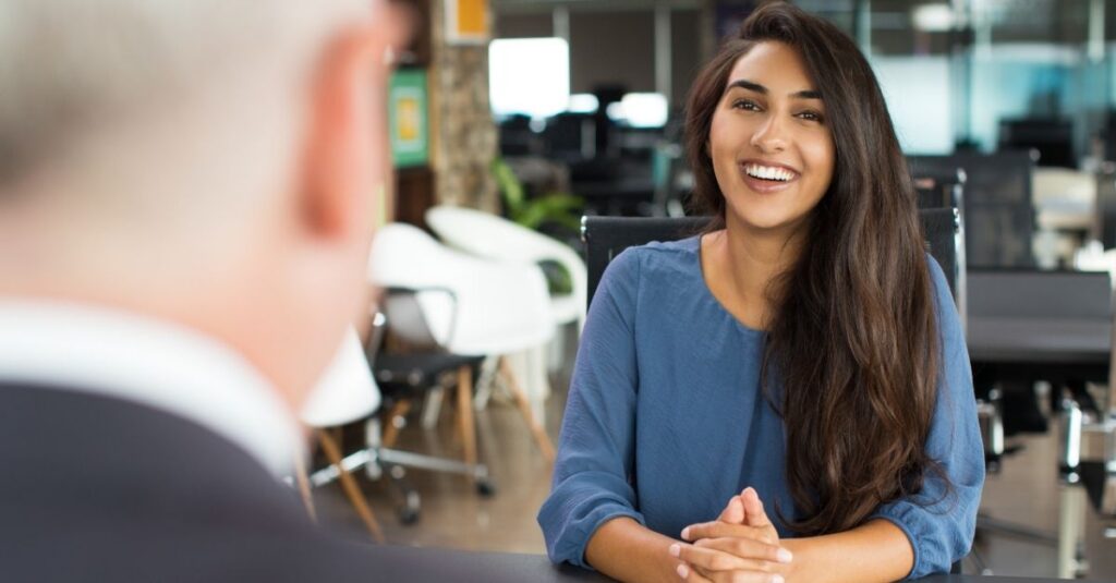 Candidate answering tough job interview questions confidently using Addison Group's advice