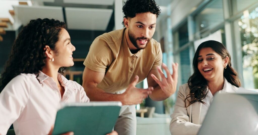 Group of people reading Addison Group's article about why you find the best HIM talent with a healthcare staffing agency