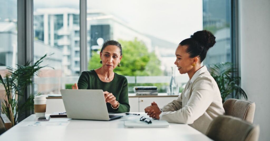 Employer in a job interview reviewing a resume of an Addison Group candidate